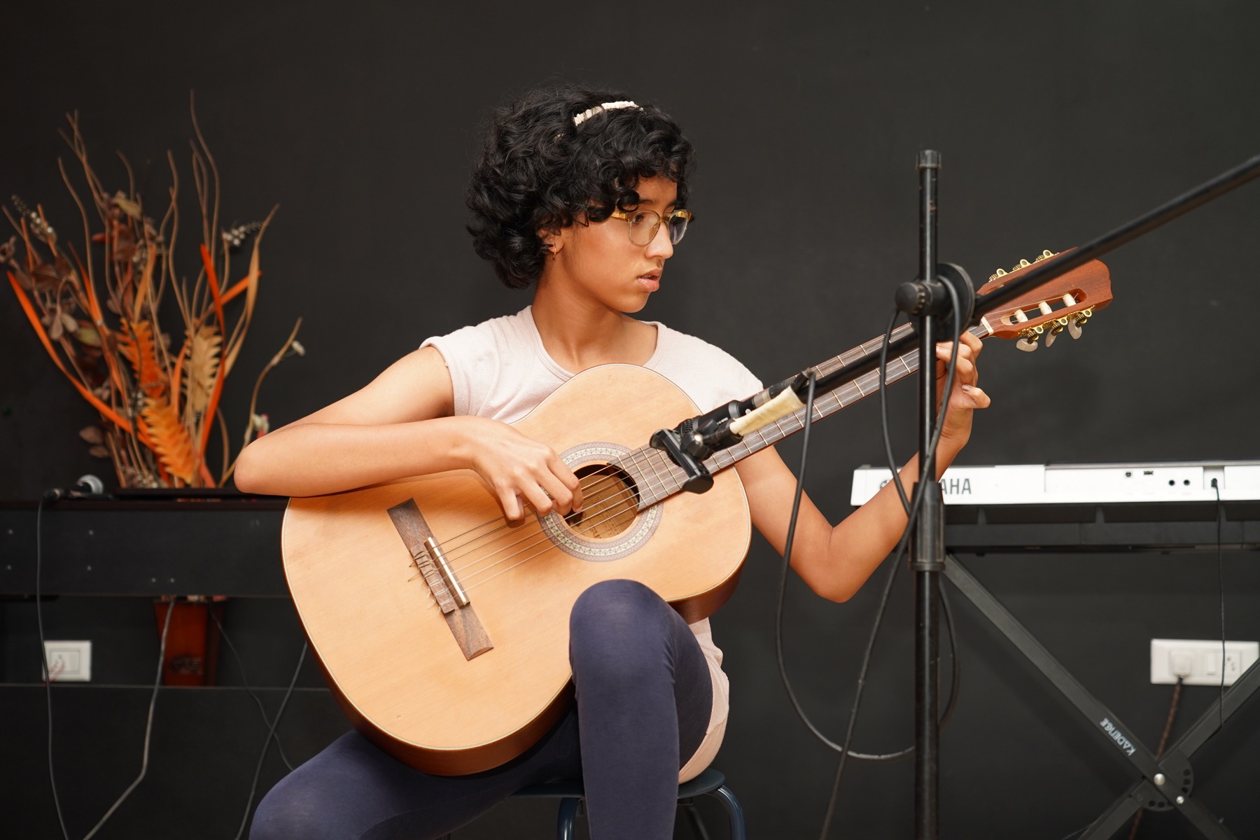 SARA Music School student performing classical guitar with focused fingerstyle technique